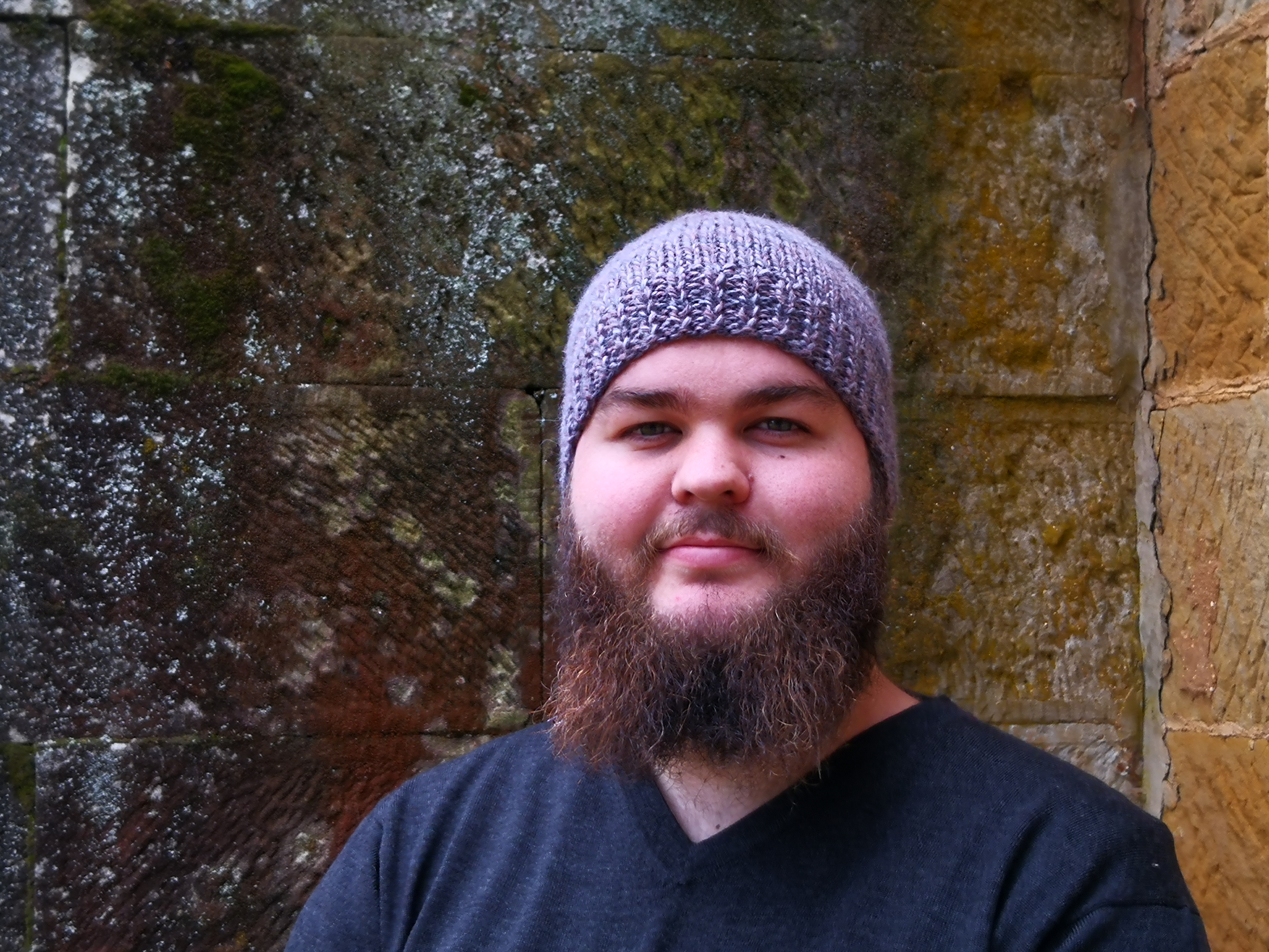 man in woolen beanie and jumper at the Tasmanian Wool Centre,